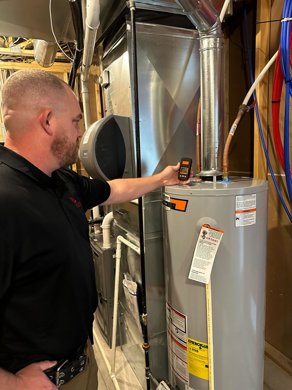 Inspecting water heater during the home inspection services.